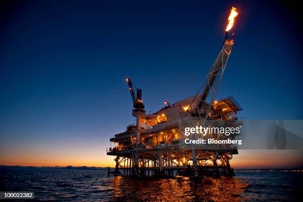 Gas is flared off from a flame boom aboard DCOR LLC's Edith offshore oil and gas platform in the Beta Field off the coast of Long Beach, California,...