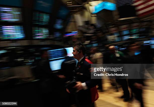 Financial professional rushes across the floor of the New York Stock Exchange near the end of the trading day May 20, 2010 in New York City. The...
