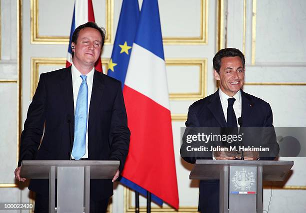 French President Nicolas Sarkozy and the new British Prime minister David Cameron give a press conference after their dinner at the Elysee Palace on...