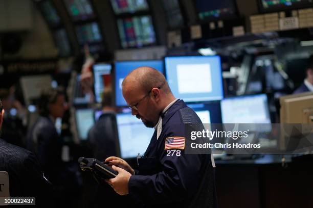 Financial professional works on the floor of the New York Stock Exchange near the end of the trading day May 20, 2010 in New York City. The market...