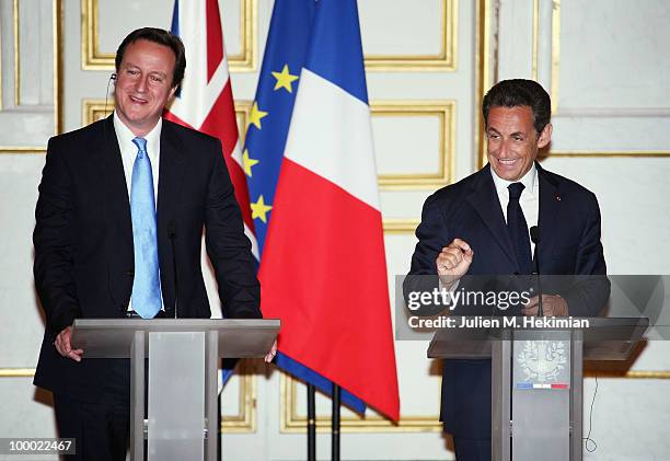 French President Nicolas Sarkozy and the new British Prime minister David Cameron give a press conference after their dinner at the Elysee Palace on...