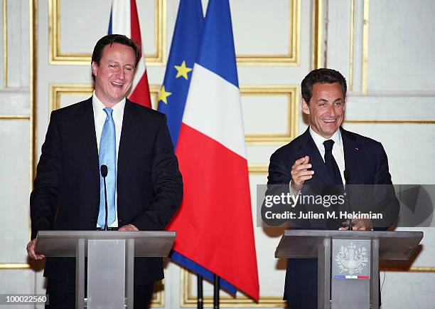 French President Nicolas Sarkozy and the new British Prime minister David Cameron give a press conference after their dinner at the Elysee Palace on...