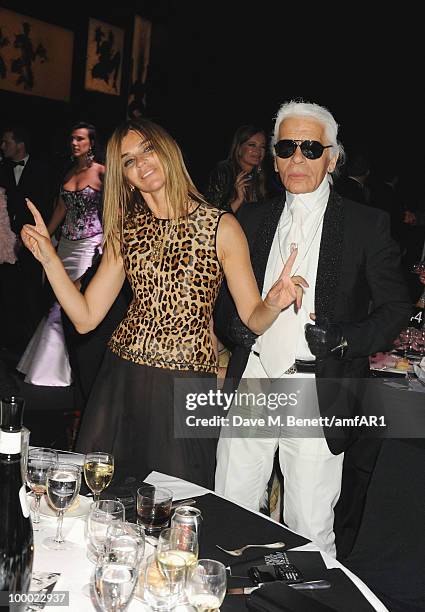 French Vogue editor Carine Roitfeld and Karl Lagerfeld attend amfAR's Cinema Against AIDS 2010 benefit gala dinner at the Hotel du Cap on May 20,...