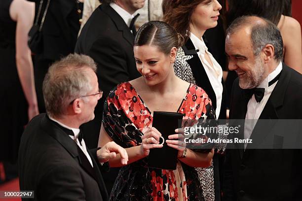 General Delegate Theirry Fremaux talks with jury member Giovanna Mezzogiorno and guest attends the "Our Life" Premiere at the Palais des Festivals...