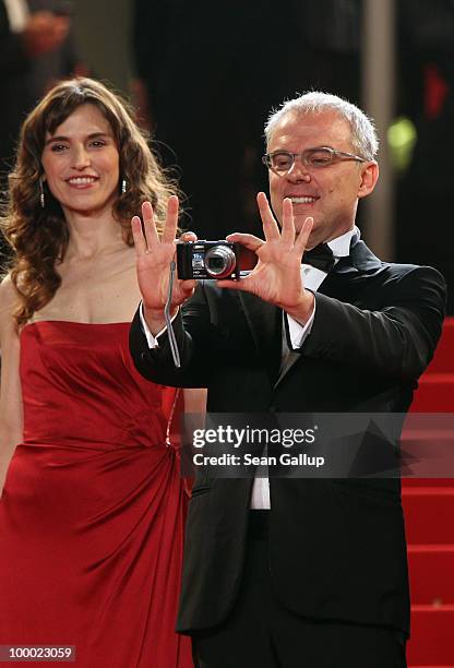 Director Daniele Luchetti takes a photo as actress Stefania Montorsi looks on attend the "Our Life" Premiere at the Palais des Festivals during the...