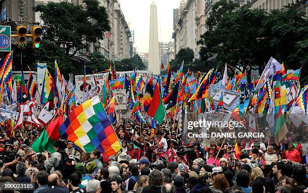 Thousands of demonstrators dance and sing as they participate in the National Indigenous March that arrived in the Plaza de Mayo in Buenos Aires...