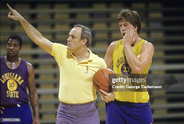 Coach Dale Brown during practice with Derrick Taylor and Ricky Blanton . Baton Rouge, LA 9/20/1985 CREDIT: George Tiedemann