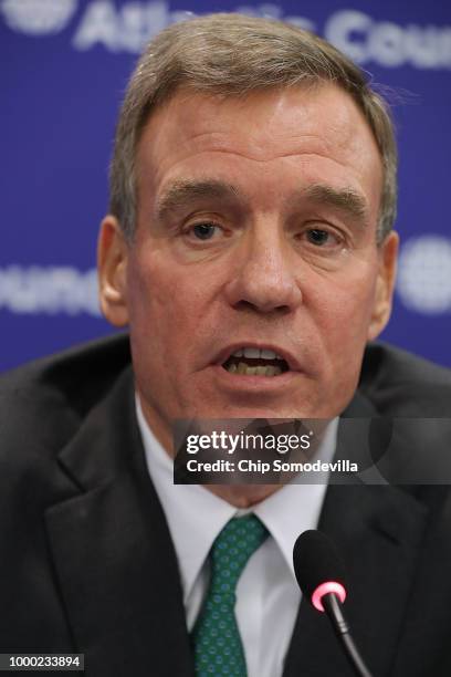 Sen. Mark Warner is joined by European counterparts for a news conference at the Atlantic Council July 16, 2018 in Washington, DC. The news...