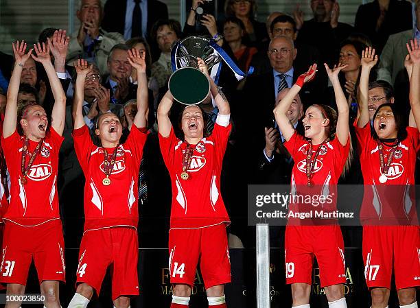 Jennifer Zietz of FFC Turbine holds up the trophy after the UEFA Women's Champions League Final match between Olympique Lyonnais and FFC Turbine...