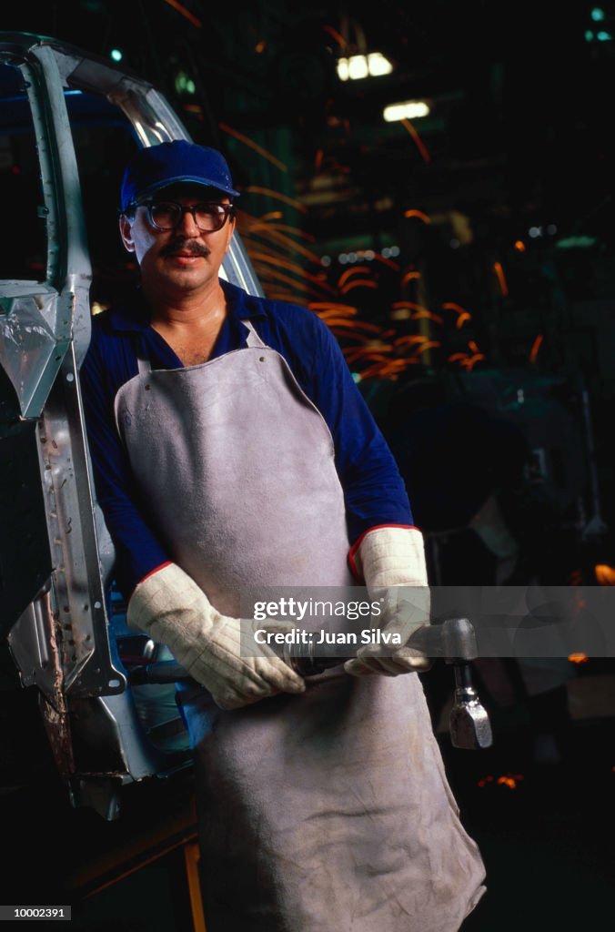 AUTO ASSEMBLY LINE WORKER WITH WRENCH