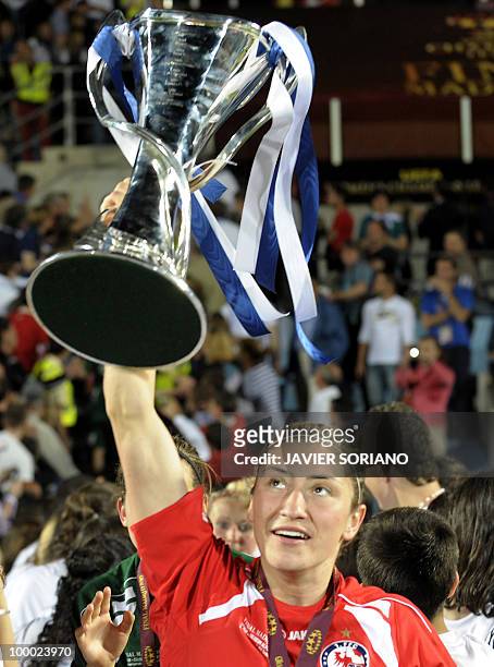 Turbine Potsdam's midfielder Jennifer Zietz holds up the trophy after wining their UEFA women's Final Champions League football match against...