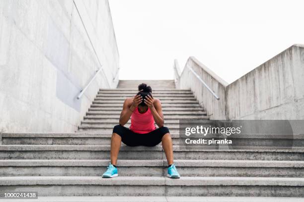 tired jogger - runner resting stock pictures, royalty-free photos & images