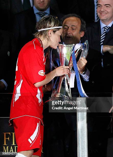 Jennifer Zietz of FFC Turbine receives the trophy from UEFA President Michel Platini after the UEFA Women's Champions League Final match between...