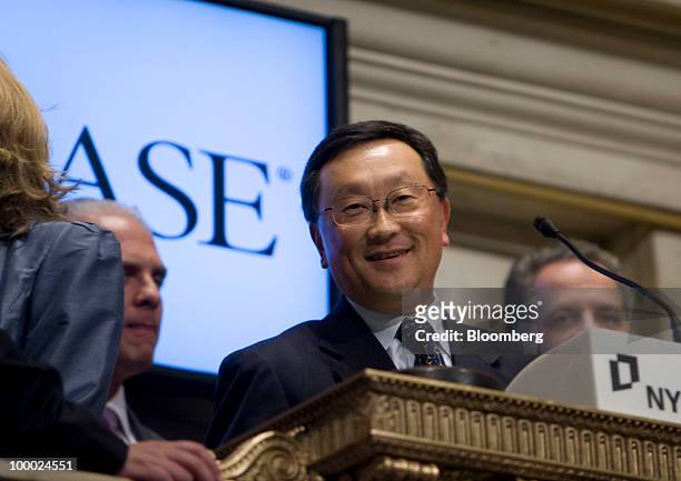 John Chen, chairman, chief executive officer and president of Sybase Inc., rings the closing bell at the New York Stock Exchange in New York, U.S.,...