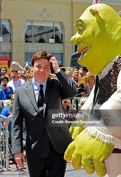 Actor Mike Myers poses with Shrek after the green ogre was honored with a star on the Walk of Fame on May 20, 2010 in Hollywood, California.