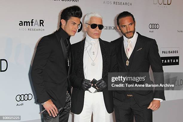 Baptiste Giabiconi and Karl Lagerfeld and guest attend the amfAR Cinema Against AIDS 2010 at the Hotel du Cap during the 63rd Annual Cannes Film...