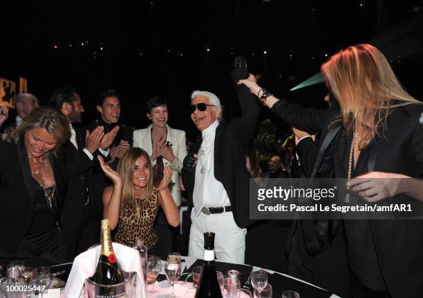 Designer Karl Lagerfeld and Editor-in-chief of French Vogue Carine Roitfeld attend amfAR's Cinema Against AIDS 2010 benefit gala dinner at the Hotel...
