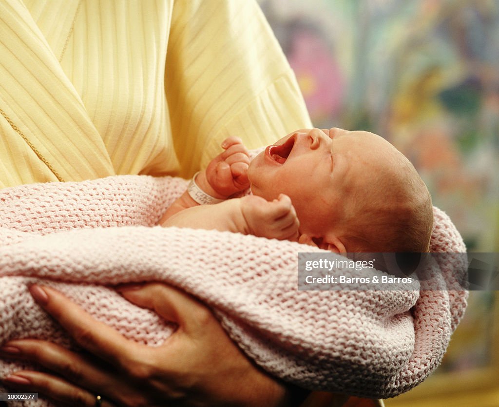 NEWBORN BABY IN MOTHER'S ARMS