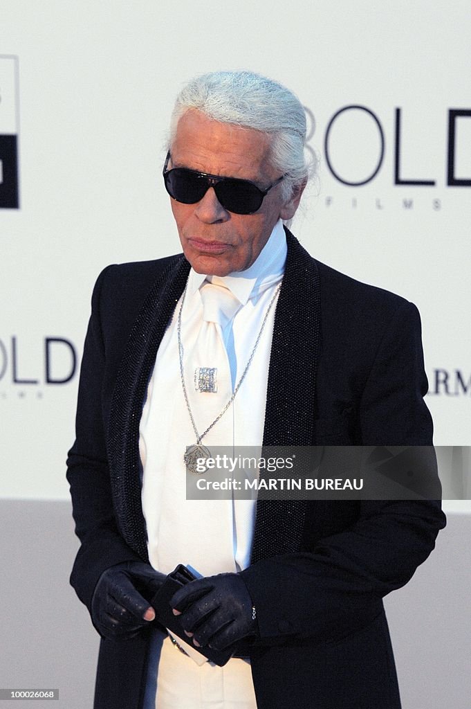 German designer Karl Lagerfeld poses whi