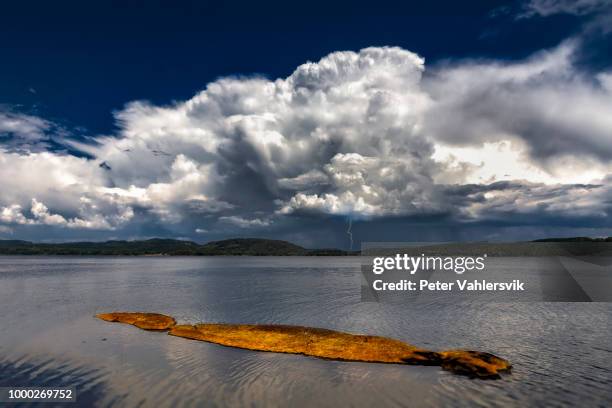 storm over lake - thunderstorm ocean blue stock pictures, royalty-free photos & images