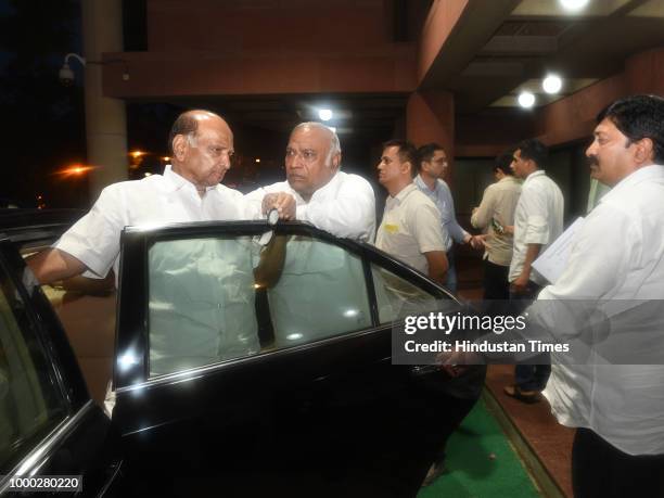 Leader Sharad Pawar with Congress party leader Mallikarjun Kharge after a meeting with opposition party leaders called by Congress party ahead of the...