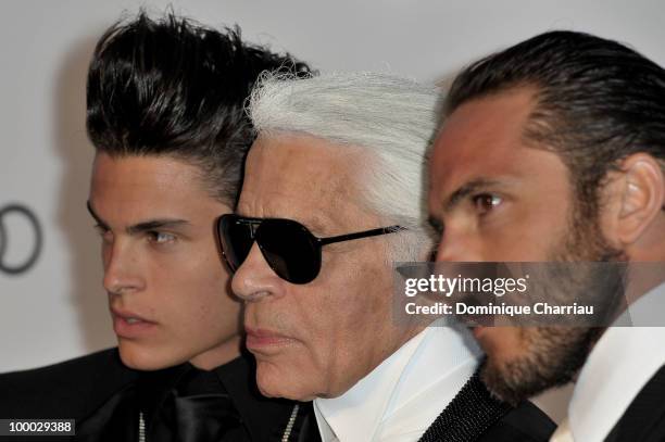 Baptiste Giabiconi, Karl Lagerfeld and Brad Kroenig arrive at amfAR's Cinema Against AIDS 2010 benefit gala at the Hotel du Cap on May 20, 2010 in...