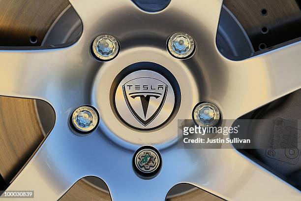The Tesla Motors logo is seen on the wheel of a car at Tesla Motors headquarters May 20, 2010 in Palo Alto, California. Electric car maker Tesla...