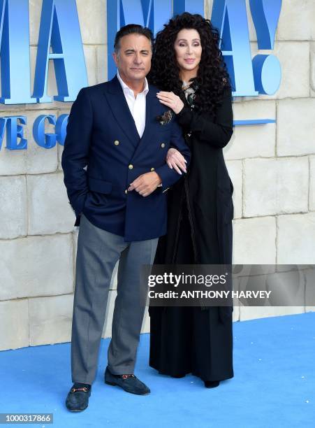 Cher and Andy Garcia pose on the red carpet upon arrival for the world premiere of the film "Mamma Mia! Here We Go Again" in London on July 16, 2018.