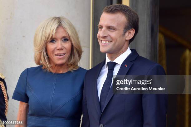French First Lady Brigitte Macron and French President Emmanuel Macron react as French President Emmanuel Macron receives the France football team...