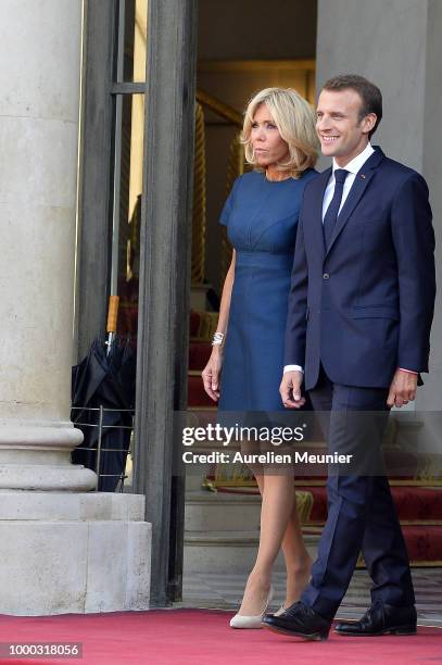 French First Lady Brigitte Macron and French President Emmanuel Macron react as French President Emmanuel Macron receives the France football team...