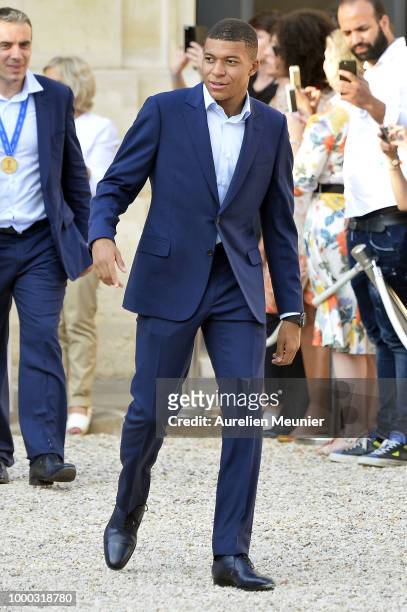 Kylian Mbappe arrives as French President Emmanuel Macron receives the France football team during a ceremony at the Elysee Palace on July 16, 2018...