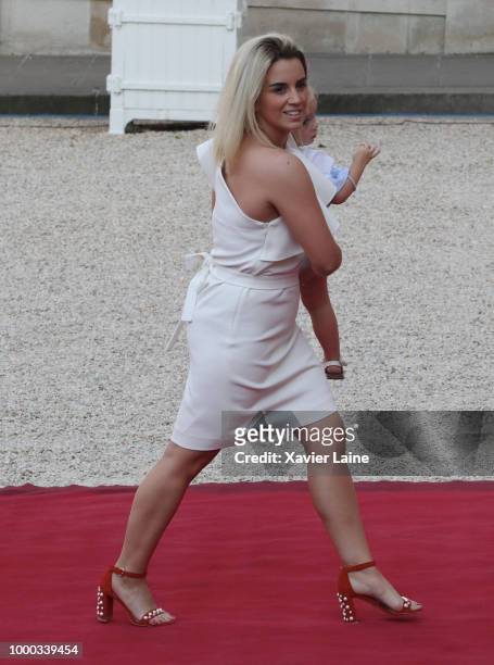 Wife of Antoine Griezmann, Erika Choperena arrive as receives France's national football team at Elysee Palace on July 16, 2018 in Paris, France....
