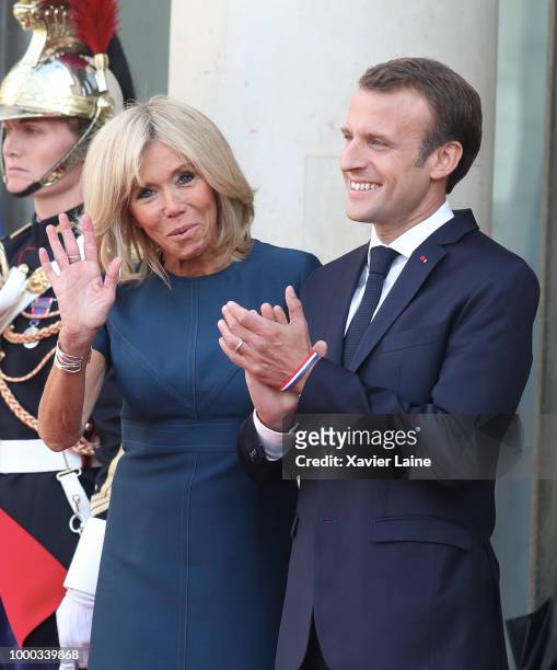 French President Emmanuel Macron and his wife Brigitte Macron receive France's national football team at Elysee Palace on July 16, 2018 in Paris,...