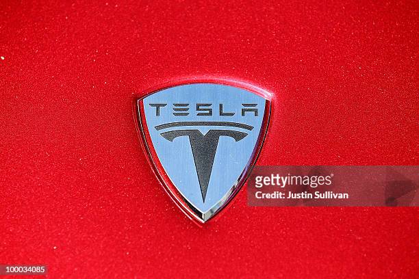 The Tesla Motors logo is seen on the hood of a car at Tesla Motors headquarters May 20, 2010 in Palo Alto, California. Electric car maker Tesla...