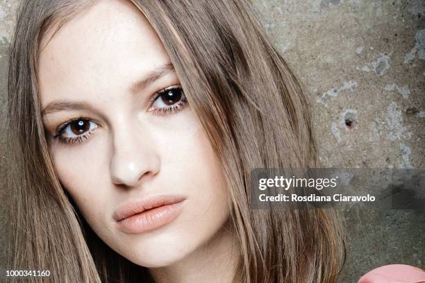 Model is seen backstage ahead of the Aniye By Fashion Show SS19 on July 16, 2018 in Milan, Italy.