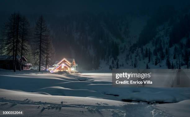 rifugio nambino in the adamello-brenta national park - villa park in the snow stock pictures, royalty-free photos & images