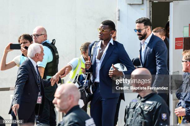 Paul Pogba and Adil Rami of France during the arrival at Airport Roissy Charles de Gaulle on July 16, 2018 in Paris, France.