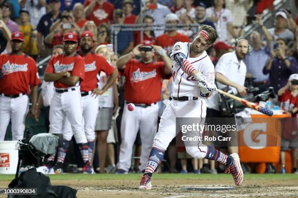 Bryce Harper of the Washington Nationals and National League hits his final home run to win the T-Mobile Home Run Derby at Nationals Park on July 16,...