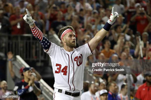 Bryce Harper of the Washington Nationals and National League celebrates after winning the T-Mobile Home Run Derby at Nationals Park on July 16, 2018...