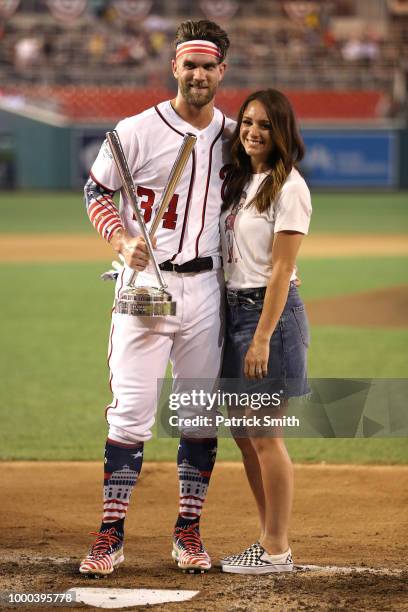 Bryce Harper of the Washington Nationals and National League celebrates with the trophy and wife Kayla Varner after winning the T-Mobile Home Run...