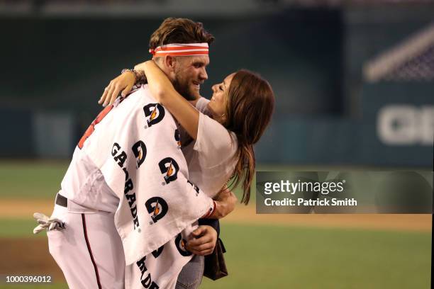 Bryce Harper of the Washington Nationals and National League celebrates with wife Kayla Varner after winning the T-Mobile Home Run Derby at Nationals...