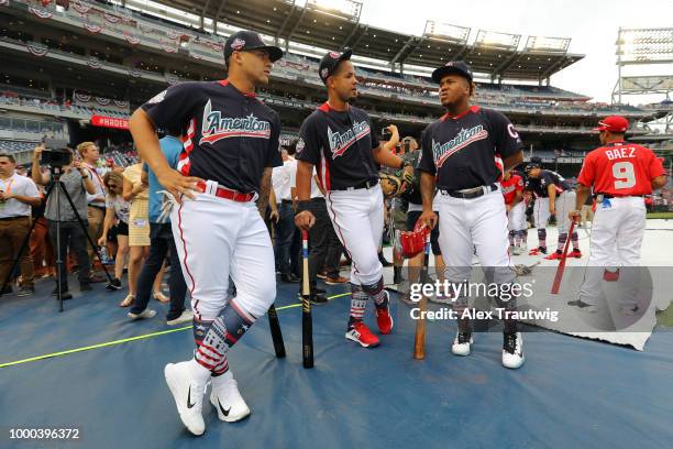 Gleyber Torres of the New York Yankees, Michael Brantley and Jose Ramirez of the Cleveland Indians talk prior to the T-Mobile Home Run Derby at...