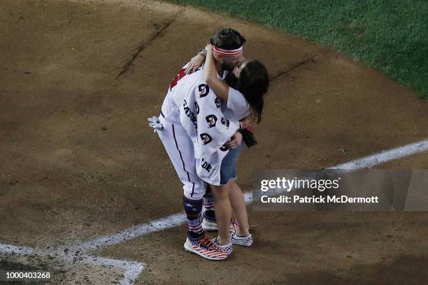 Bryce Harper of the Washington Nationals and National League celebrates with wife Kayla Varner after winning the T-Mobile Home Run Derby at Nationals...