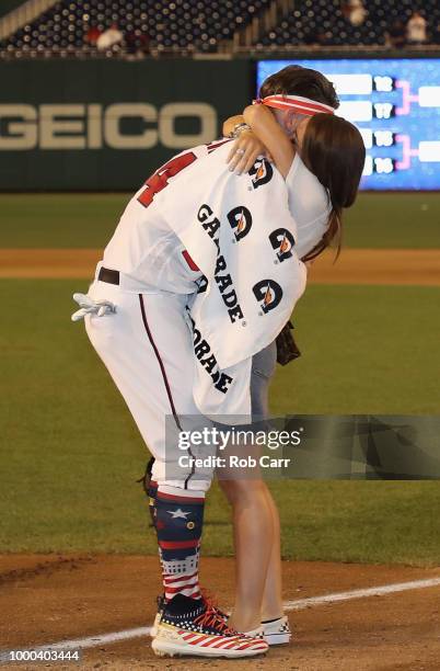 Bryce Harper of the Washington Nationals and National League celebrates with wife Kayla Varner after winning the T-Mobile Home Run Derby at Nationals...