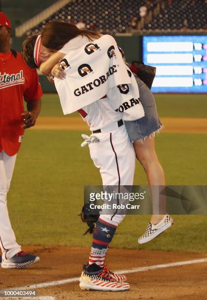 Bryce Harper of the Washington Nationals and National League celebrates with wife Kayla Varner after winning the T-Mobile Home Run Derby at Nationals...