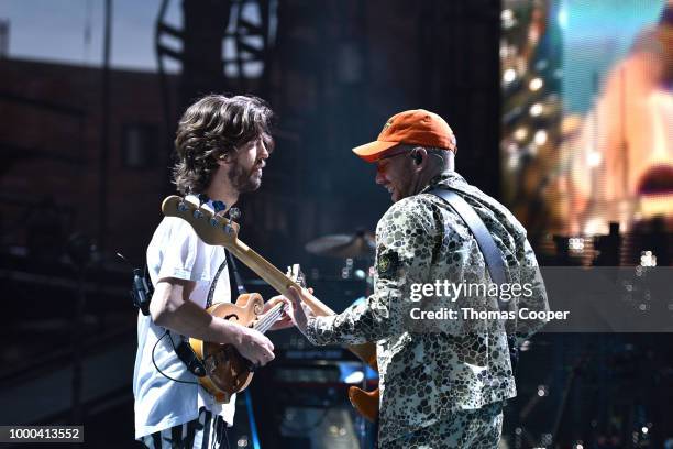 Wayne Sermon and Ben McKee of Imagine Dragons performs during their Evolve World Tour stop at Red Rocks Amphitheatre on July 16, 2018 in Morrison,...