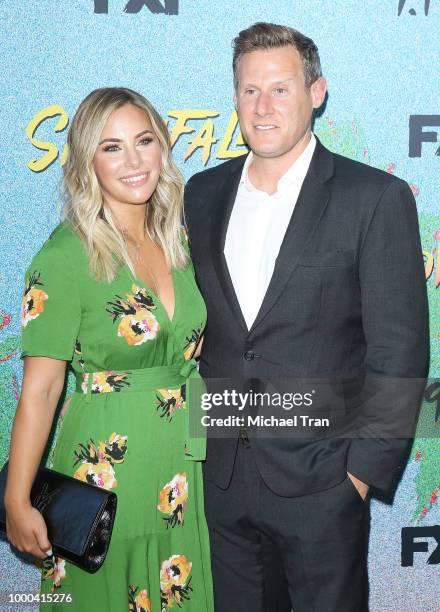 Trevor Engelson and Tracey Kurland arrive to the Los Angeles premiere of FX's "Snowfall" Season 2 held at Regal Cinemas L.A. LIVE Stadium 14 on July...