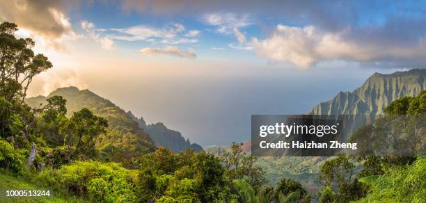 sunset over kalalau valley - na pali coast stock pictures, royalty-free photos & images