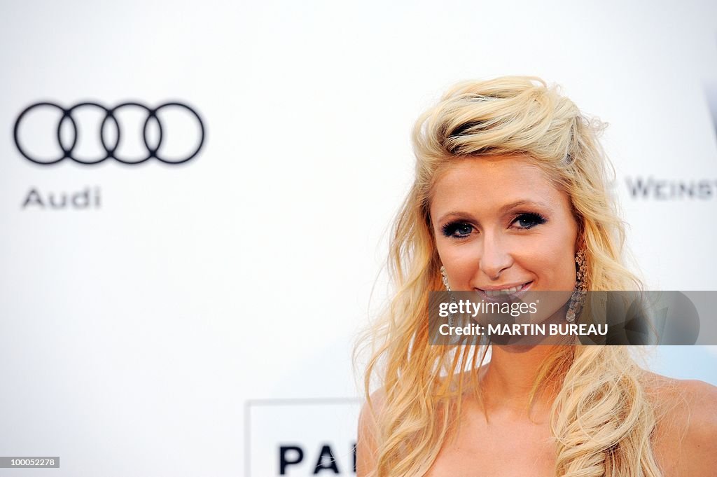 US Paris Hilton poses while arriving to