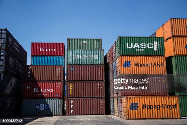 Containers are seen at terminal in the Duisburg port on July 16, 2018 in Duisburg, Germany. Approximately 25 trains a week use the "Silk Road"...